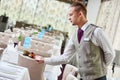 Restaurant waiter serving table with food Royalty Free Stock Photo