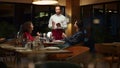 Restaurant waiter taking order serving romantic couple on evening dinner date. Royalty Free Stock Photo