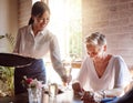 Restaurant, waitress and senior woman wine tasting for luxury, celebration or fine dining at a vineyard or in Royalty Free Stock Photo