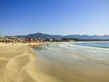 Restaurants and people enjoying the sunny day at Barra da Lagoa beach in Florianopolis, Brazil