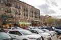 Restaurants, shops, and bars along River Street with colorful signs and balconies at sunset with a cobblestone road, people Royalty Free Stock Photo