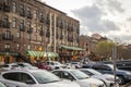 Restaurants, shops, and bars along River Street with colorful signs and balconies at sunset with a cobblestone road, people Royalty Free Stock Photo