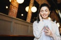 Restful brunette woman with lovely appearance closing her eyes w Royalty Free Stock Photo