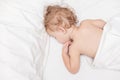 Restful two years old baby girl sleeping on bed Royalty Free Stock Photo