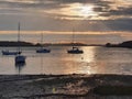 Resting boats at dusk with sunrays