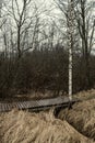 resting camping place in the woods with benches and trail in late autumn