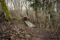 resting camping place in the woods with benches and trail in late autumn