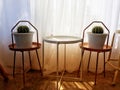 The resting corner of the house is displayed with cantas in white pots. Royalty Free Stock Photo