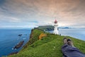 Resting after hiking at Mykines Lighthouse, Faroe Islands Royalty Free Stock Photo
