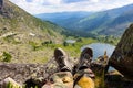 Resting male legs in front of the amazing landscape Royalty Free Stock Photo