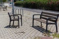 Resting place with chairs and cycle stands on the footpath