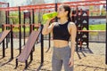 Resting time. Sporty girl drink water from a bottle. Royalty Free Stock Photo