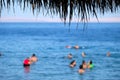 Resting tourists at Sinai Red Sea beach. Royalty Free Stock Photo