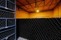 Resting wine bottles stacked in the cellar of a Malbec winery factory, San Juan, Argentina, also seen in Mendoza