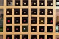 Resting wine bottles stacked on wooden racks