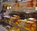 Resting wine bottles stacked on wooden racks in the Kaufhaus des Westens