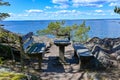restingplace with two benches and a table overlooking lake Vattern Motala Sweden april 30 2022