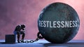 Restlessness and an alienated suffering human. A metaphor showing Restlessness as a huge prisoner's ball bringing pain a