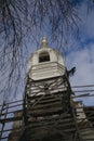 Restoration of the bell tower. Scaffolding around the ancient bell tower.