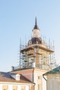 Restoration of the bell tower on the tower of a traditional Orthodox church in Moscow. Wooden walkways. Religious malpractice