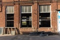 Restoration of an old red brick factory building. Replacing windows in a vintage brick building Royalty Free Stock Photo