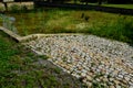 restoration of a pond with a stone wall buried under the terrain. fire tank