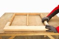 Close up of a carpenter repairing sash window frame Royalty Free Stock Photo