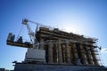 Restoration work in progress at world heritage ancient Parthenon on top of Acropolis with machine crane, scaffolding