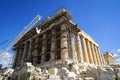 Restoration work in progress at world heritage classical Parthenon on marble block base on top of Acropolis with machine crane Royalty Free Stock Photo