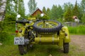 Restored bright green retro motorcycle with sidecar