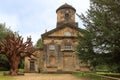 Restored 18 century chapel and Iron Tree sculpture in Yorkshire Sculpture Park. Royalty Free Stock Photo