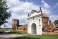 Restored entrance gate and remains of the walls of the Carthusian monastery of 1648-1666 in the town of Bereza, Belarus