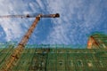 Restored house and construction crane