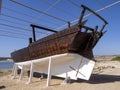 Restored old boat in the ruins of the old town of Khor Rori, on the Silk Road. Oman Royalty Free Stock Photo