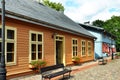 Restored old wooden houses with painted doors and window frames Royalty Free Stock Photo