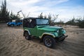 Restored retro car during the American Vietnam war on the sand in the desert of Vietnam Royalty Free Stock Photo