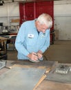 Restorer Buffing Aluminum for Memphis Belle Royalty Free Stock Photo