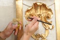 Restorer manually gilding listed interior