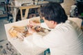 Restorer working with antique decor Royalty Free Stock Photo