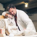 Restorer working with gypsum model Royalty Free Stock Photo