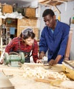 Restorers working with wooden furniture