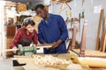 Restorers working with wooden furniture