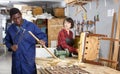 Restorers working with wooden furniture