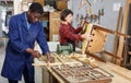 Restorers working with wooden furniture