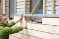 Restoring old brick house facade with wooden planks Royalty Free Stock Photo