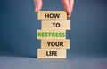 Restress your life symbol. Concept words How to restress your life on wooden blocks. Doctor hand. Beautiful grey background.