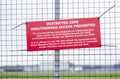 Restricted air space zone sign at airport barrier fence no unauthorised access