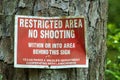 Restricted area no shooting sign