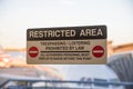 Restricted Area Sign On Airport Door Royalty Free Stock Photo