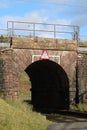 Restricted height road bridge under railway line Royalty Free Stock Photo